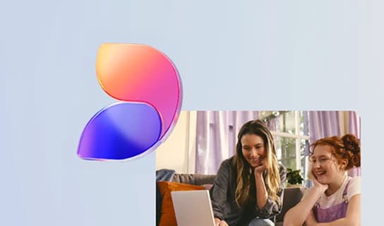 A glass logo mark beside two people at a laptop
